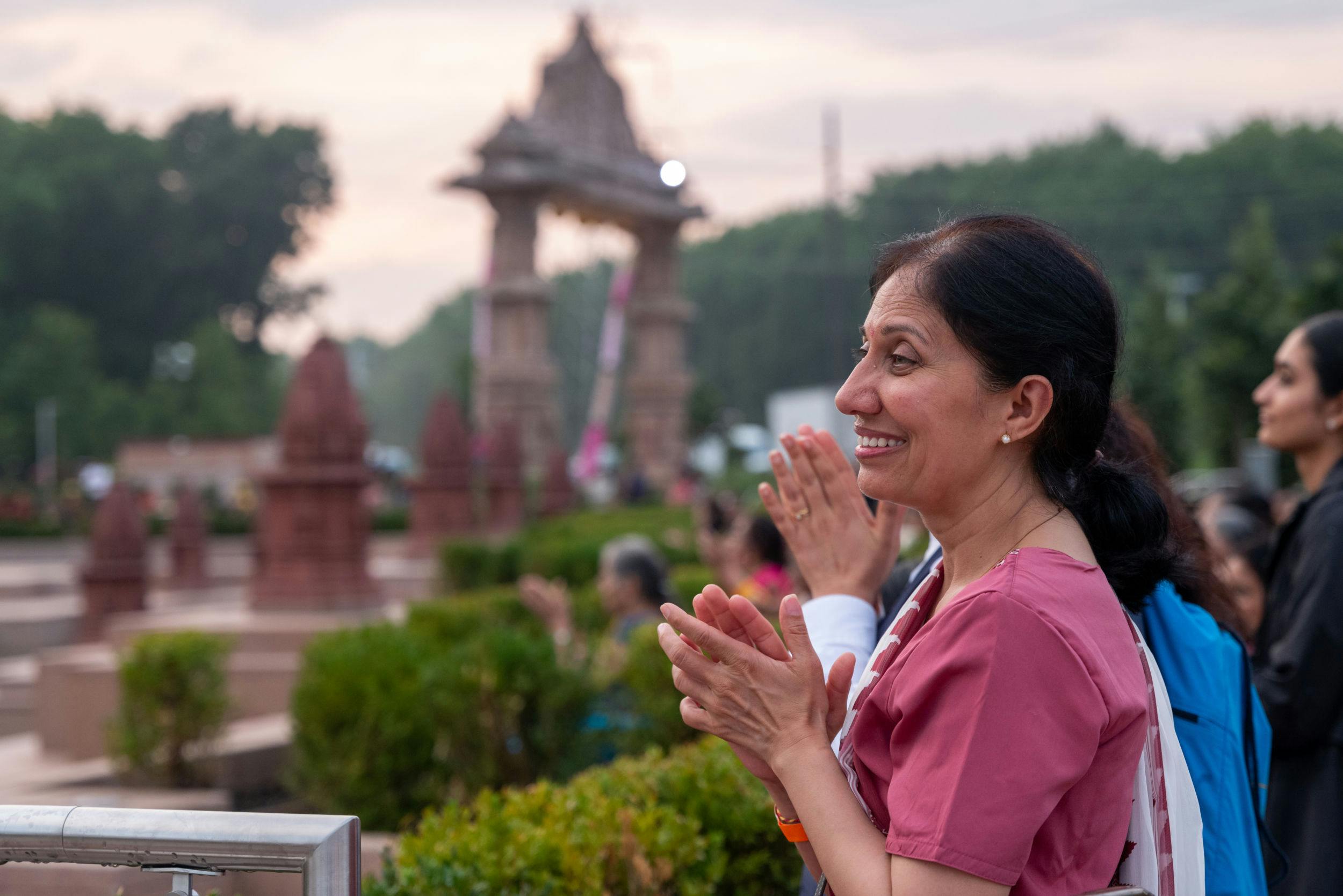 A devotee is joyfully engaged in the darshan of Swamishri.